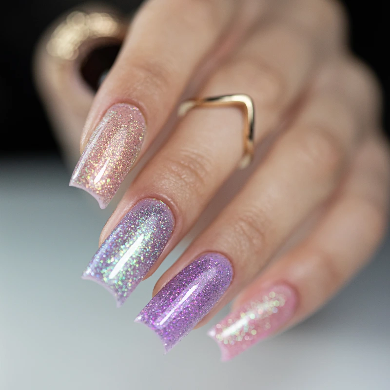 Pastel glitter manicure in pink and purple shades