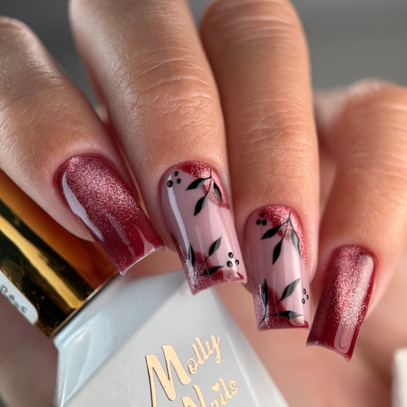 Red velvet cat eye nails with botanical details on a transparent base