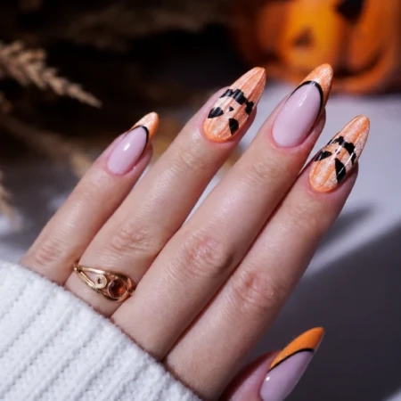 Halloween nails with a pumpkin design