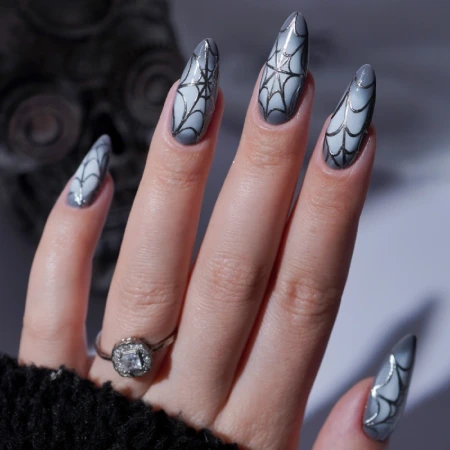 Long Halloween nails with a spiderweb design