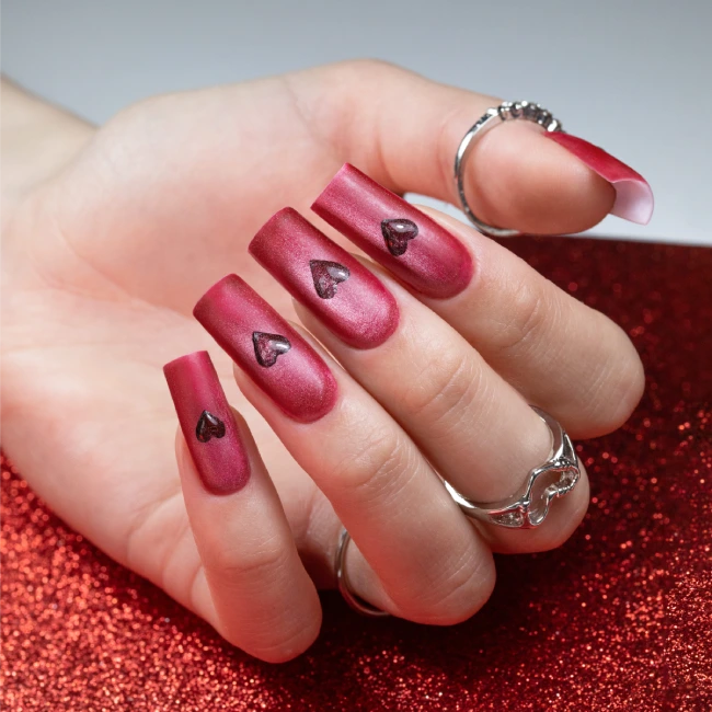 Red Cat Eye manicure with heart detail on square nails