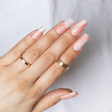 Milky white ombré nails with a subtle shimmer