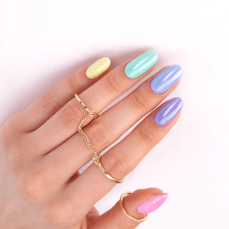 Pastel skittle nails with a glazed finish in pink, purple, blue and mint shades