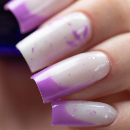 Purple spring nails with a pastel wash effect, a milky base and metallic foil