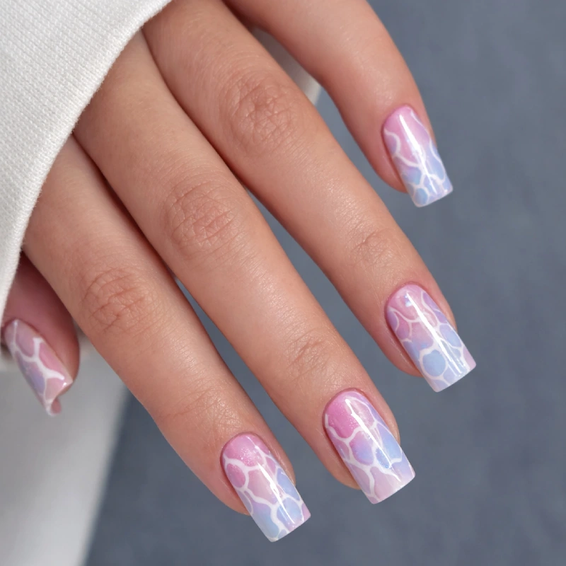 Pastel pink and blue nails with white abstract nail art