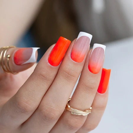 Neon orange ombré nails with a white French tip – summer manicure
