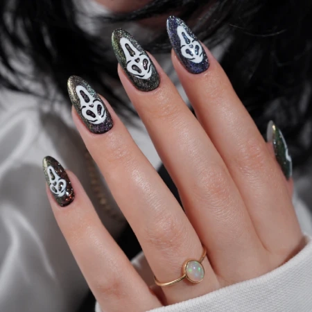Halloween nails with a horror movie mask design
