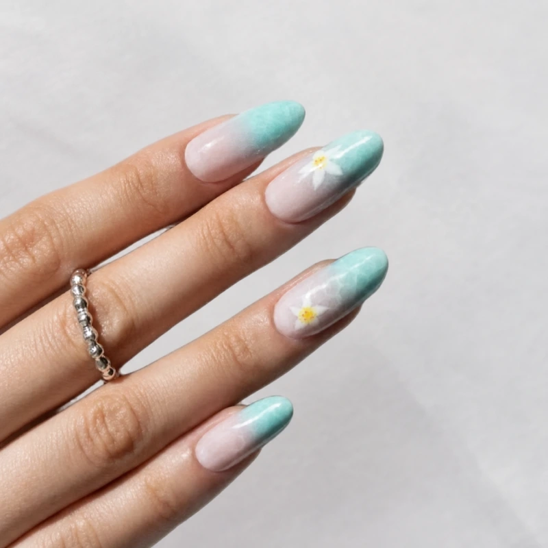 Mint ombré spring nails with white floral nail art