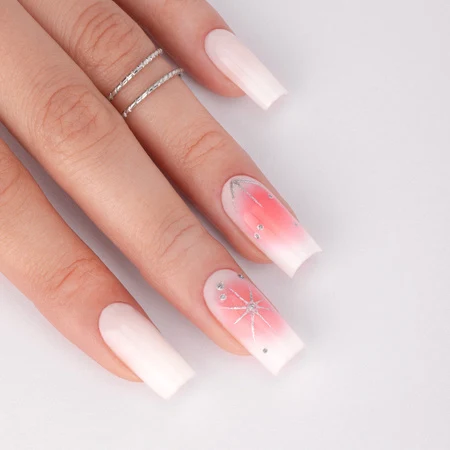 White summer nails with pink accents on tanned skin