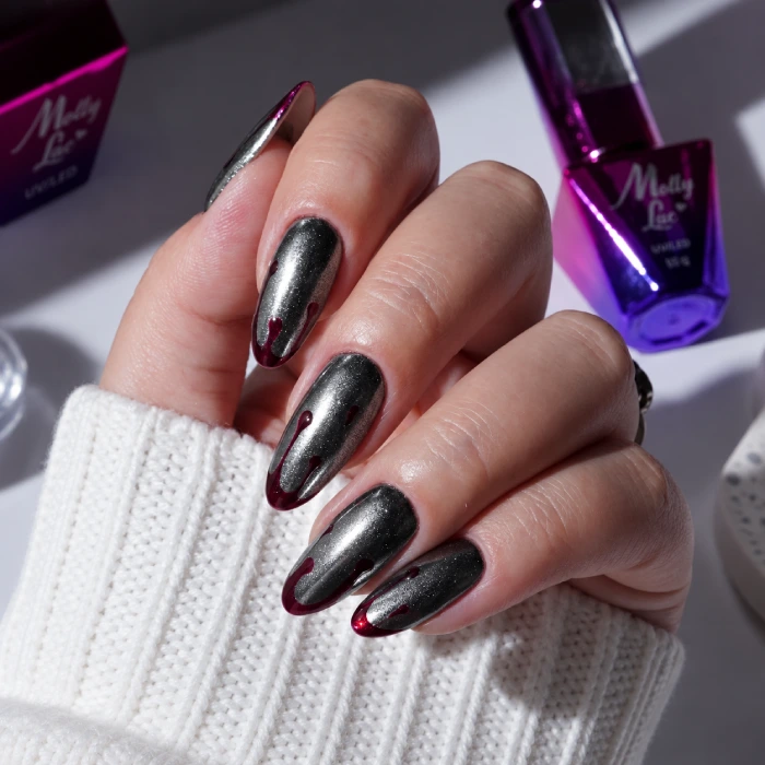 Long silver Halloween nails with blood-inspired drops