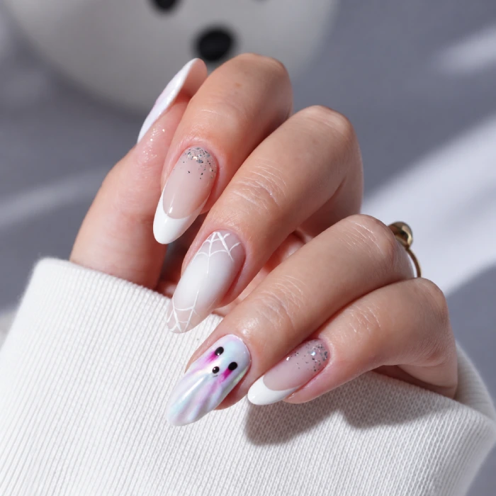 Halloween nails with a ghost and spiderweb design